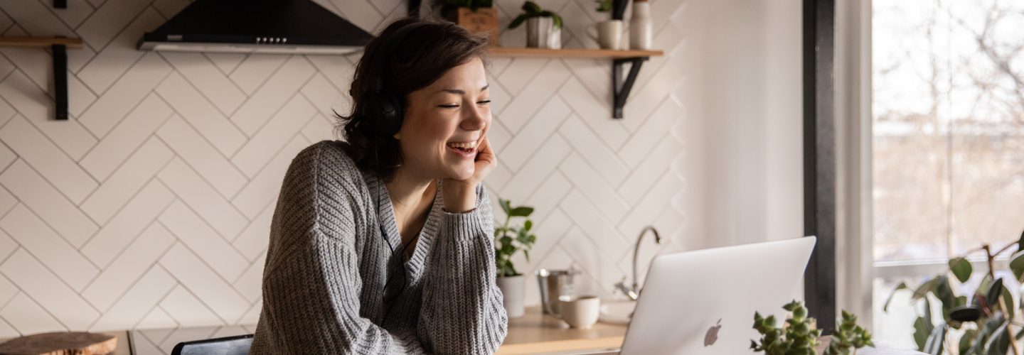 Woman looking at laptop liverpool online programmes