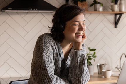 Woman looking at laptop liverpool online programmes