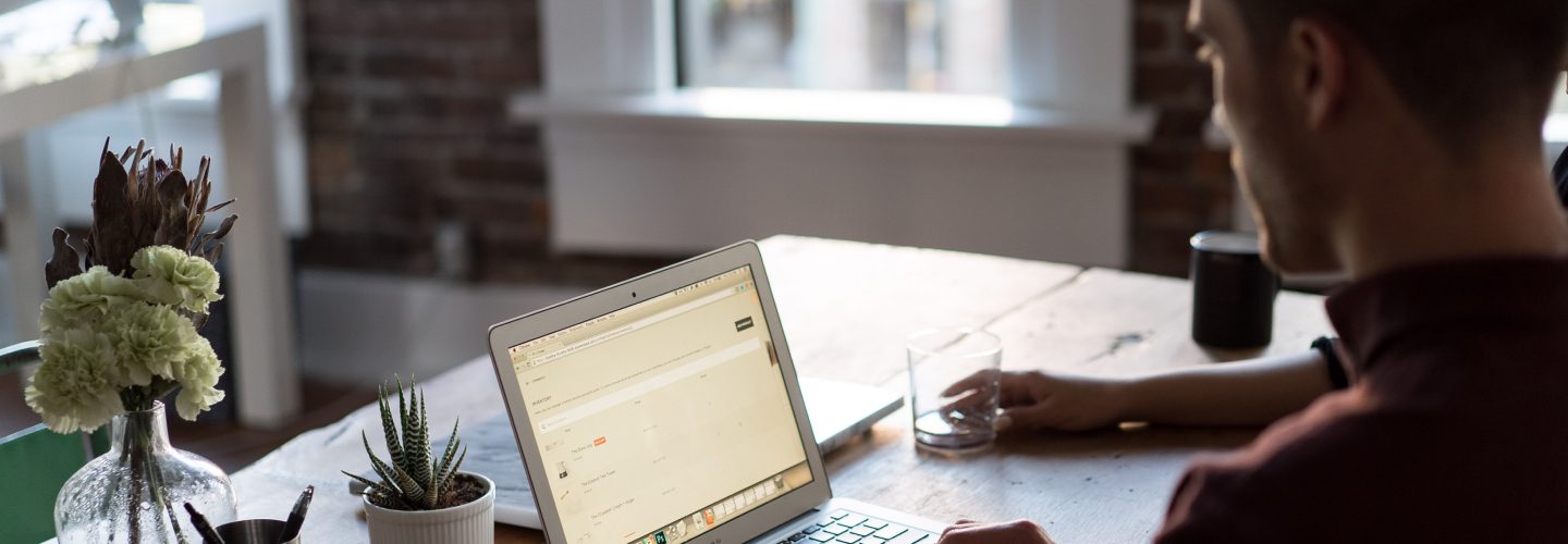 Image of a student on a computer studying