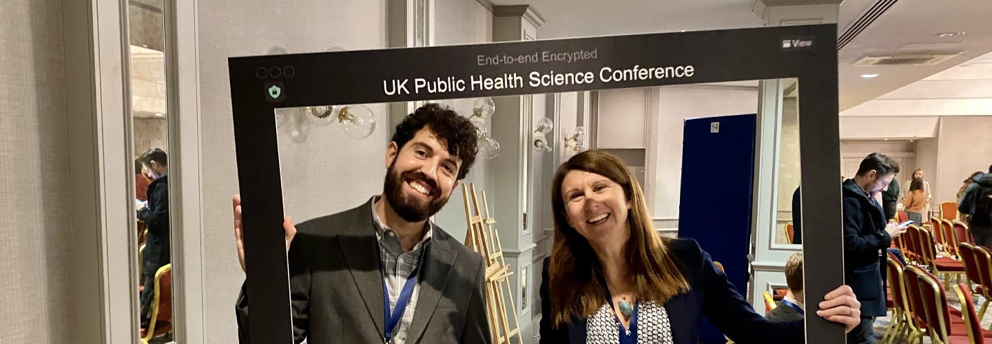 A University of Liverpool Online Student smiling in Public Health Conference