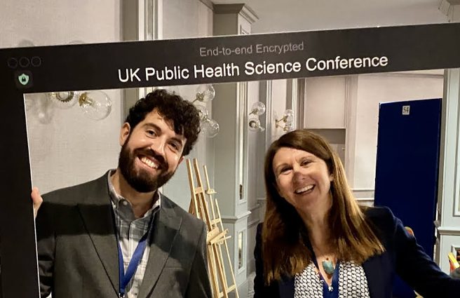 A University of Liverpool Online Student smiling in Public Health Conference