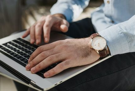 Person typing on laptop