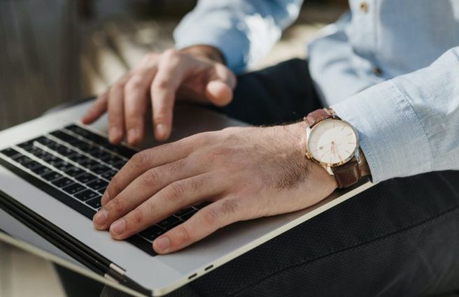 Person typing on laptop