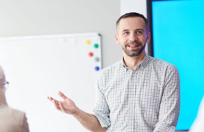 Person talking to a classroom of students