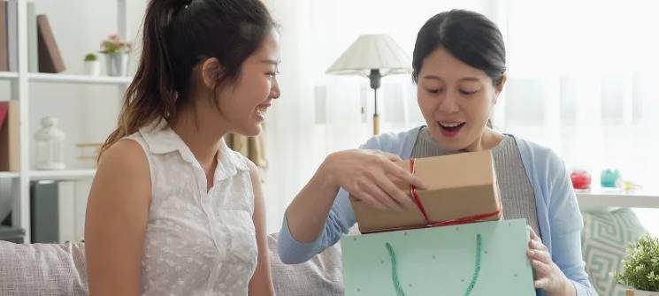 A friend receiving a gift from another friend
