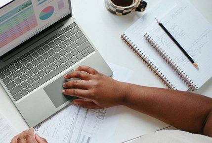 Finance professional working on a laptop