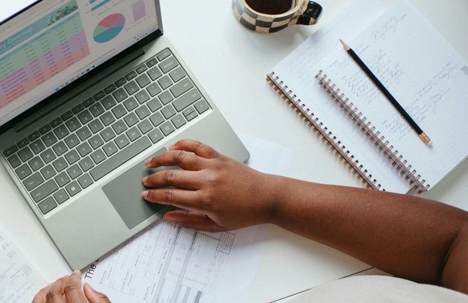 Finance professional working on a laptop