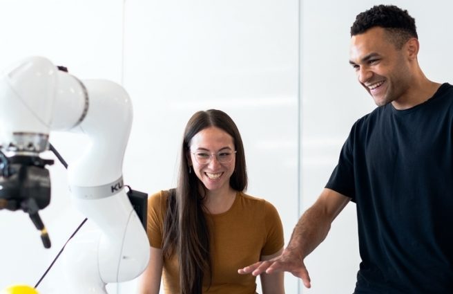 People testing a robotic hand